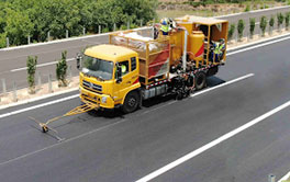 Truck-mounted thermoplastic road marker with pointer guide for precision highway line marking