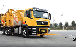 Modern truck-mounted road marking equipment parked and ready for highway maintenance tasks