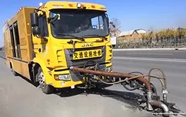 Automatic road line removal vehicle performing highway maintenance with high safety standards