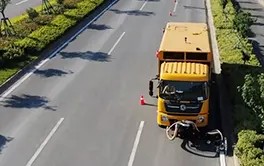 Aerial view of road marking removal vehicle demonstrating efficient long-distance line stripping