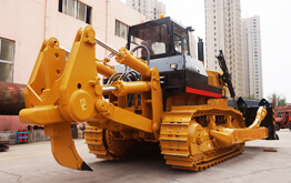 Hydraulic crawler bulldozer performing road base preparation