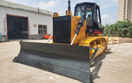 Construction site land clearing with heavy duty track bulldozer