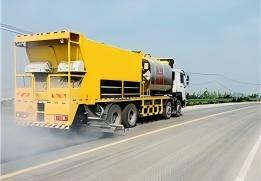 chip sealer with independent spray nozzles